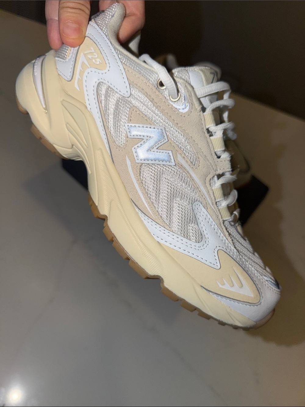 New Balance Women’s 725 Sneakers in White and Cream